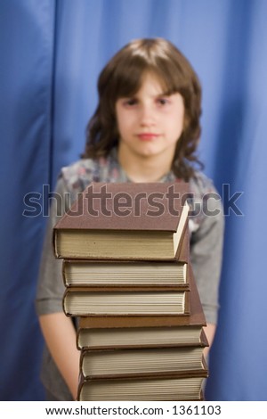 Child in front of books - focus on books