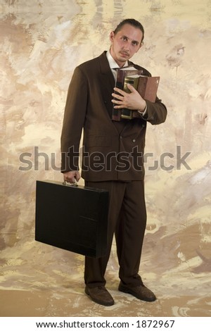 Businessman with books and briefcase