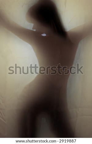 Woman sexy silhouette behind linen textile