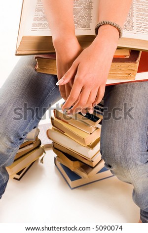 Young student girl with books on white backgrounds