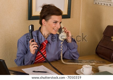 Business woman making consultation via phone at office