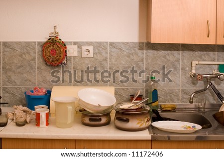 Dirty dishes on sink in the kitchen