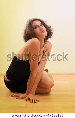 Young sexy girl model posing at sitting pose