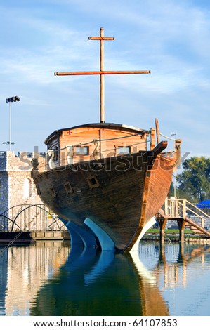 Wooden vintage ship docked in port