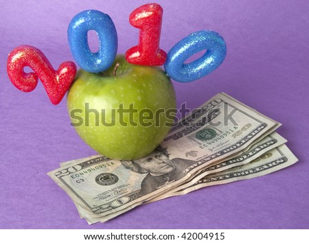 Granny Smith Green Apple American currency represents the concepts of the cost of diet and healthy lifestyle. Also works for a high cost of healthcare or education concept.