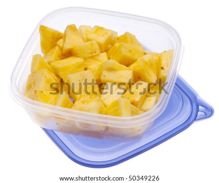 Leftover cut pineapple in a plastic storage container.