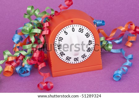 It\'s time to party! Clock and streamers on purple.