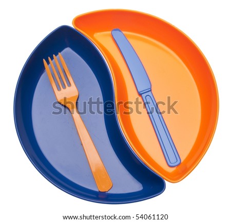 Yin Yang Shaped Plastic Dishes with Silverware Isolated on White with a Clipping Path.