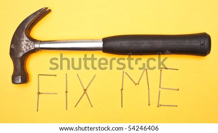 Fix Me Written in Nails with a Hammer.