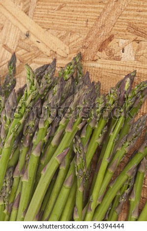 Tips of Fresh Asparagus on a Natural Background.