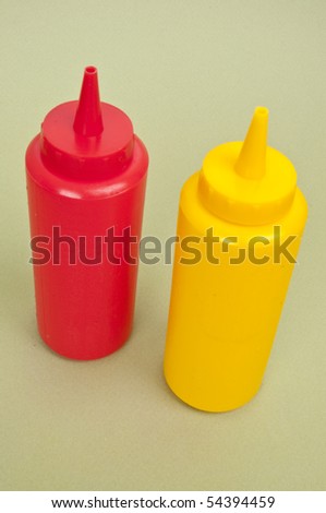 Fun Ketchup and Mustard Bottles on a Green Background.