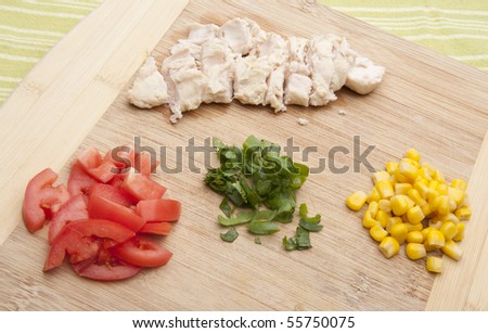 Chicken, Tomatoes, Cilantro and Corn Ingredients for Making a Chicken Wrap or Sandwich.