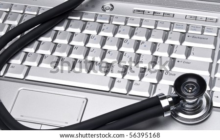 Medical Records Conceptual Image with Stethoscope and Laptop Computer.