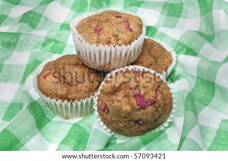 Healthy Whole Wheat Rhubarb Muffins on a Vibrant Green Picnic Blanket