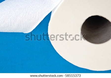 Modern Toilet Paper Concept Image on a Blue Background.