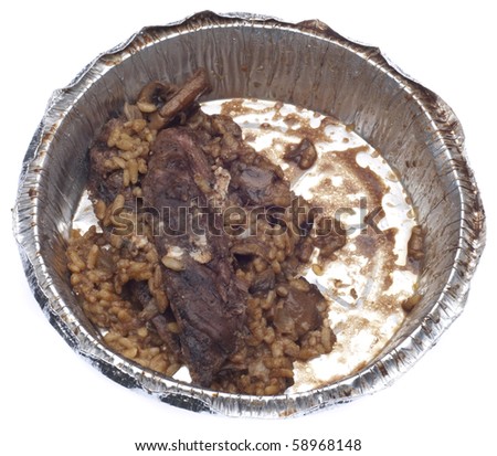 Leftover Steak and Risotto Dinner in a Restaurant Take Away Container Isolated on White.