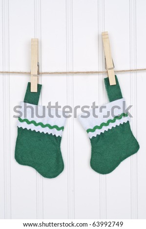 Holiday Stockings Hanging on a Clothesline on a White Background.