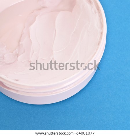 Pink Vitamin E Lotion on a Vibrant Background.  Everyday Object Close Up.