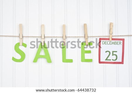 SALE on a Clothesline with a Christmas Calendar Page.  Holiday Concept.
