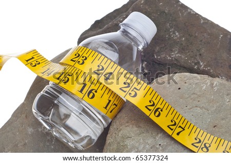 Diet and Fitness Concept with Bottle of Water on Rocks and Measuring Tape.