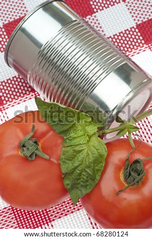 Canned Tomato Soup Concept with Fresh Tomatoes and Can of Soup.