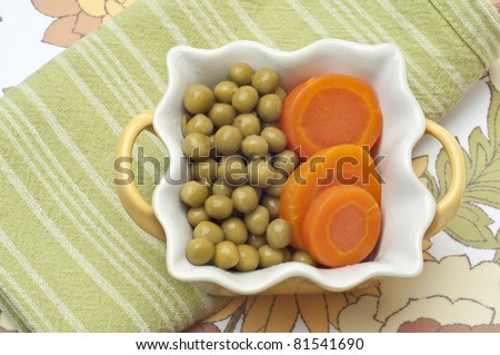 Bowl of Peas and Carrots Healthy Vegetable Still Life.