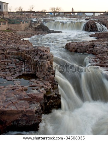 The falls on the Big Sioux River that give Sioux Falls, SD its name.  Viewed from the tower in Falls Park at sunset.