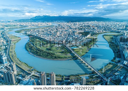 Taipei City Aerial View - Asia business concept image, panoramic modern cityscape building bird’s eye view under sunrise and morning blue bright sky, shot in Taipei, Taiwan.