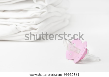 Fresh baby laundry with soother