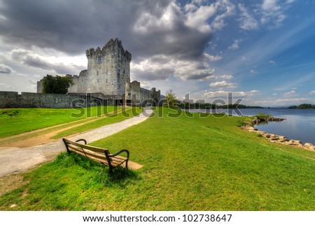 Ross Castle with empty bench near Killarney, Co. Kerry Ireland