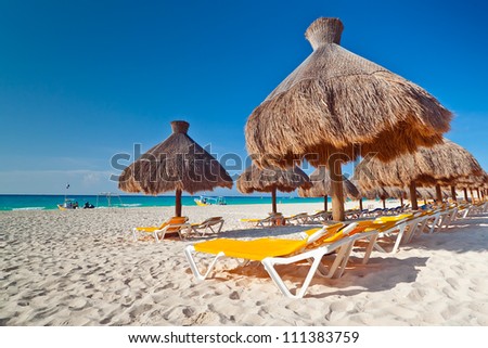 Holidays under parasol on Caribbean beach