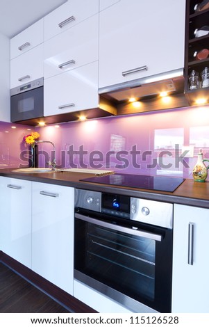 Modern white and purple kitchen interior Modern white and purple kitchen interior