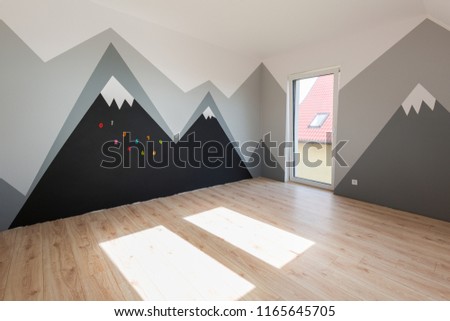 Kids bedroom with mountains paint and new laminated floor