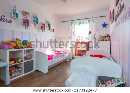 Kids bedroom interior with pastel color wallpapers
