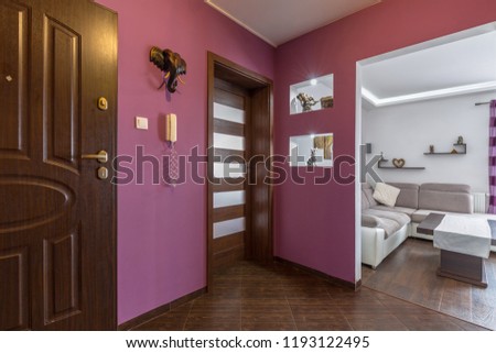 Purple hall interior in the apartment