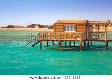 Wooden pier with change room house on Red Sea in Egypt