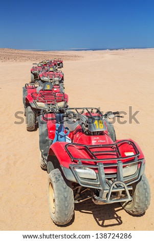 HURGHADA, EGYPT - APR 16: Quad trip on the desert near Hurghada on 16 April 2013. Desert safari is one of the main local tourist attraction in Egypt.