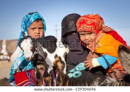 Hurghada, Egypt - Apr 10: Unidentified Arabic Family With Goat And Donkey On The Local Bus Station Near Hurghada On 10 Apr 2013. This Bus Station Is Tourist Attraction On The Way To Luxor.