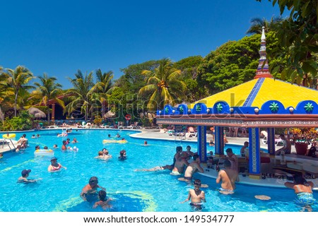PLAYA DEL CARMEN, MEXICO - JULY 20: Scenery of luxury swimming pool at RIU Yucatan Hotel  in Playa del Carmen on July 20, 2011. RIU Hotels & Resorts has more than 100 hotels in 19 countries.