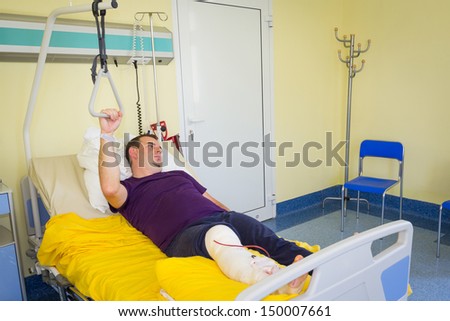 Man lying in hospital after arthroscopic surgery