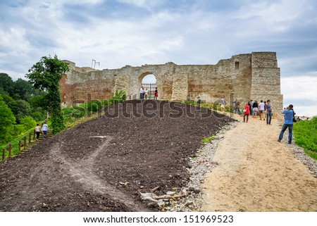 KAZIMIERZ DOLNY, POLAND - JUL 14: Unidentified people walking at the castle ruins in Kazimierz Dolny on 14 of July 2013. This 14th century castle was built by Casimir III the Great, the king of Poland