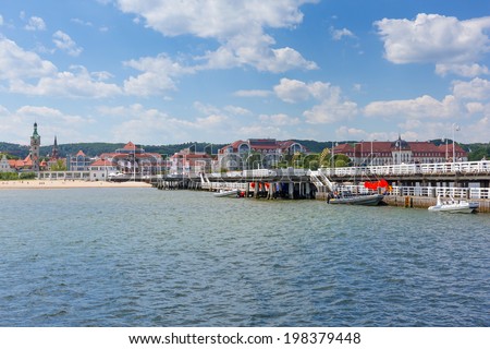 SOPOT, POLAND - 7 JUNE: Sopot molo at Baltic Sea on 7 June 2014. Sopot is major health and tourist resort destination and this pier with 511.5 meters long is the longest wooden pier in Europe.