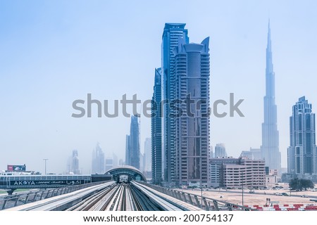 DUBAI, UAE - MARCH 31: Metro line in Dubai on March 31, 2014, UAE. The Dubai Metro is a driverless, fully automated metro rail network in the city of Dubai and carry over 180,000 passengers every day.