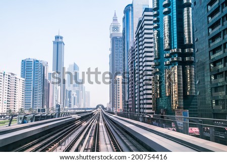 DUBAI, UAE - MARCH 31: Metro line in Dubai on March 31, 2014, UAE. The Dubai Metro is a driverless, fully automated metro rail network in the city of Dubai and carry over 180,000 passengers every day.