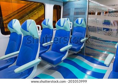 DUBAI, UAE - 31 MARCH 2014: Metro line interior in Dubai, UAE. The Dubai Metro is a driverless, fully automated metro rail network in the city of Dubai and carry over 180,000 passengers every day.