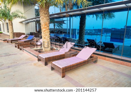 DUBAI, UAE - 31 MARCH 2014: Pool area of The Grand Midwest Tower Hotel in Dubai, UAE. The Grand Midwest Group owns 4 hotels in Dubai with over 700 rooms.
