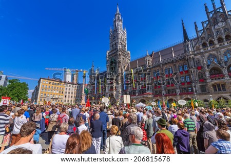 MUNICH, GERMANY - 19 JUNE 2014: People at the New Town Hall on the Feast of Corpus Christi,  Munich, Germany. The New Town Hall built between 1867 and 1908 represents Gothic Revival architecture style