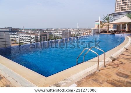 DUBAI, UAE - 2 APRIL 2014: Pool area of The Grand Midwest Tower Hotel in Dubai, UAE. The Grand Midwest Group owns 4 hotels in Dubai with over 700 rooms.