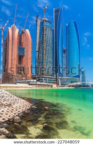 ABU DHABI, UAE - 28 MARCH 2014: Etihad Towers buildings in Abu Dhabi, United Arab Emirates. Five towers complex with 74 floors is the third tallest building in Abu Dhabi.