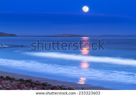 Full moon at Atlantic ocean in Ireland